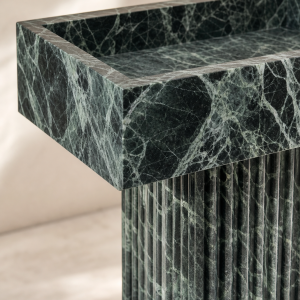 Edge and fluted-pedestal detail of the Rhythm Emerald stone vanity