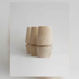 Light Ring Travertine Vase in a landscape view