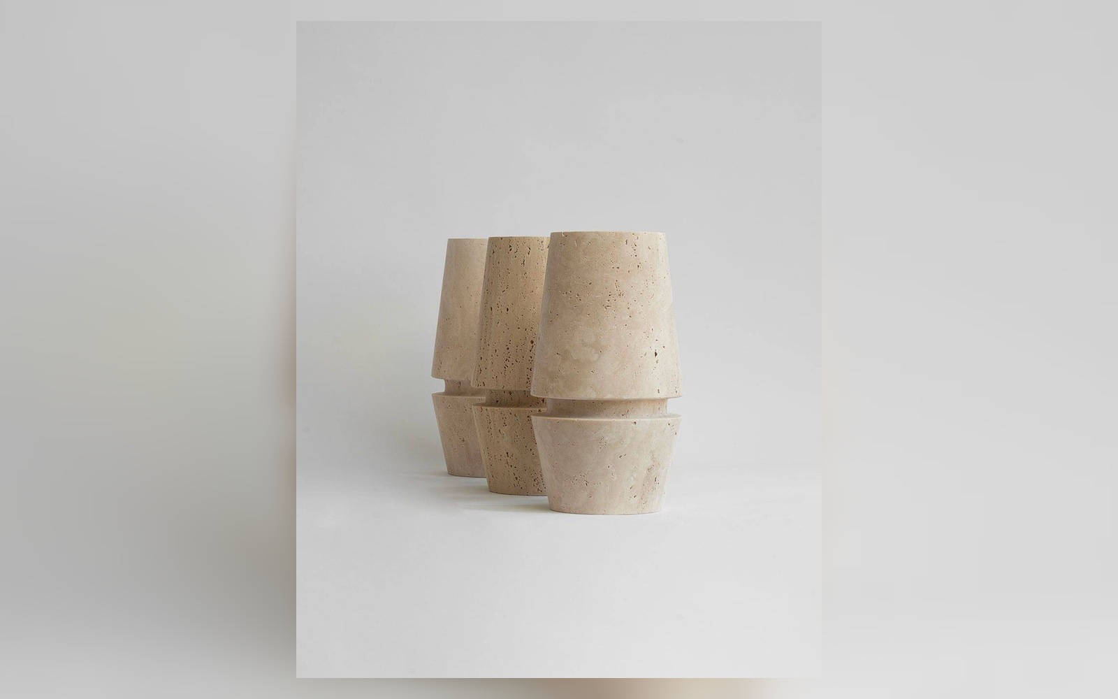 Light Ring Travertine Vase in a landscape view